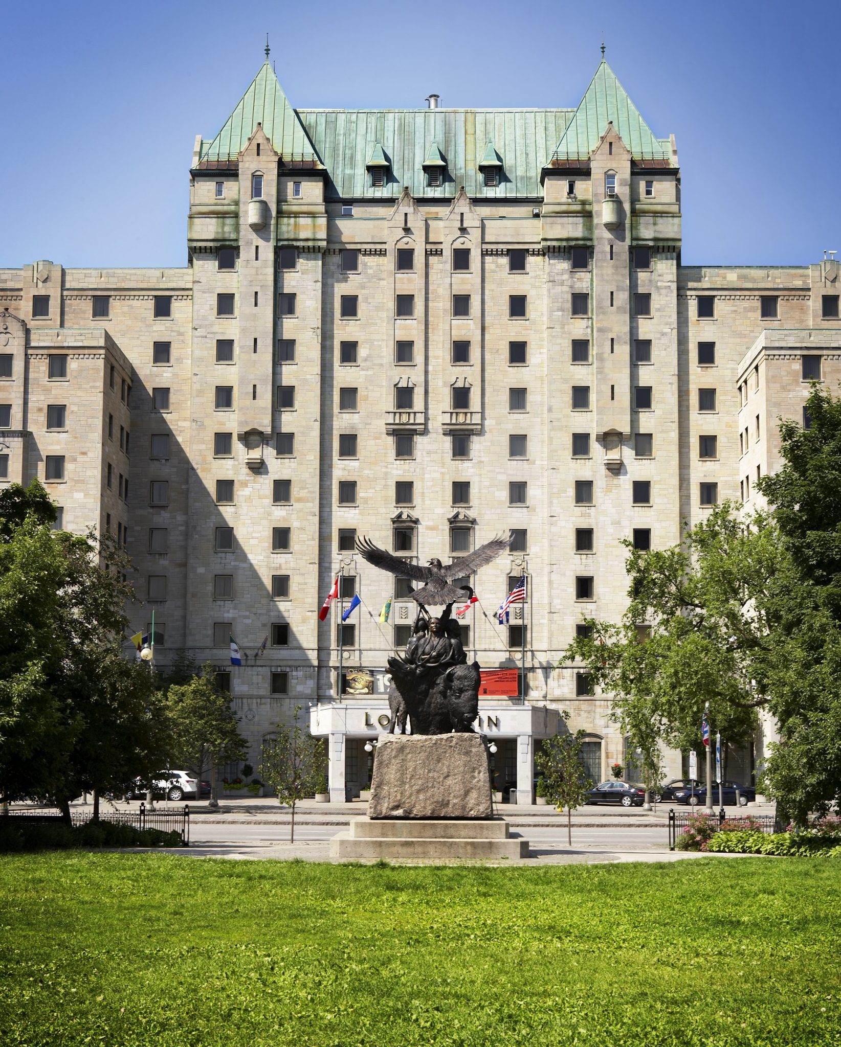 Lord Elgin Hotel and Indigenous Monument from Confederation Park, Ottawa, Ontario