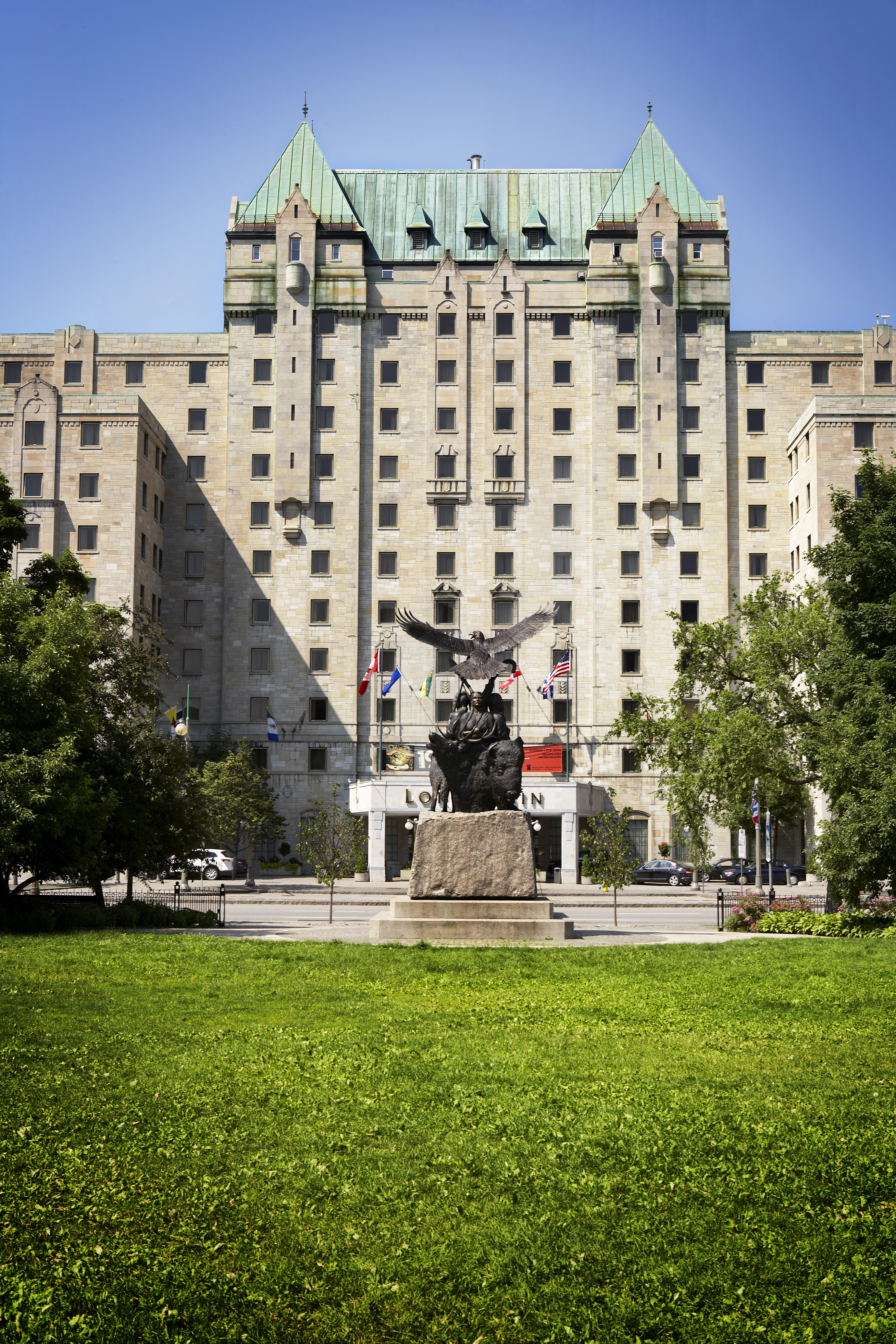 Lord Elgin Hotel and Indigenous Monument from Confederation Park, Ottawa, Ontario