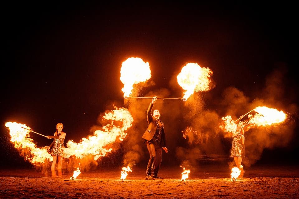 Fire breathers and wielders at Ottawa Buskerfest at night.
